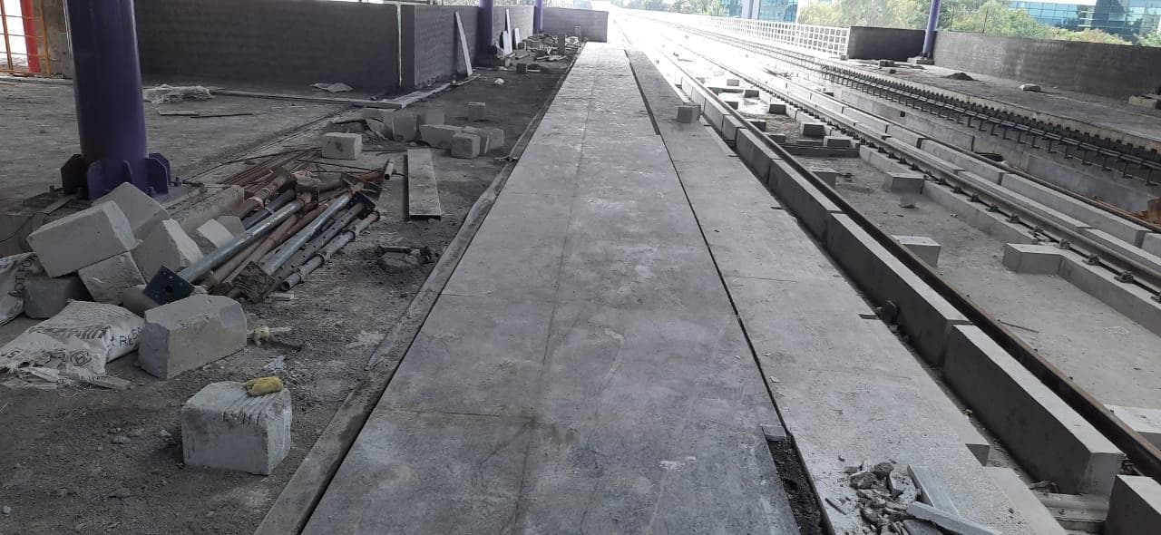 Platform floor and edge works running along the track.
