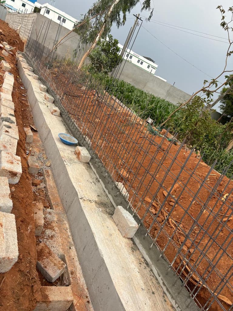 Reinforcement and stone masonry at the retaining wall.