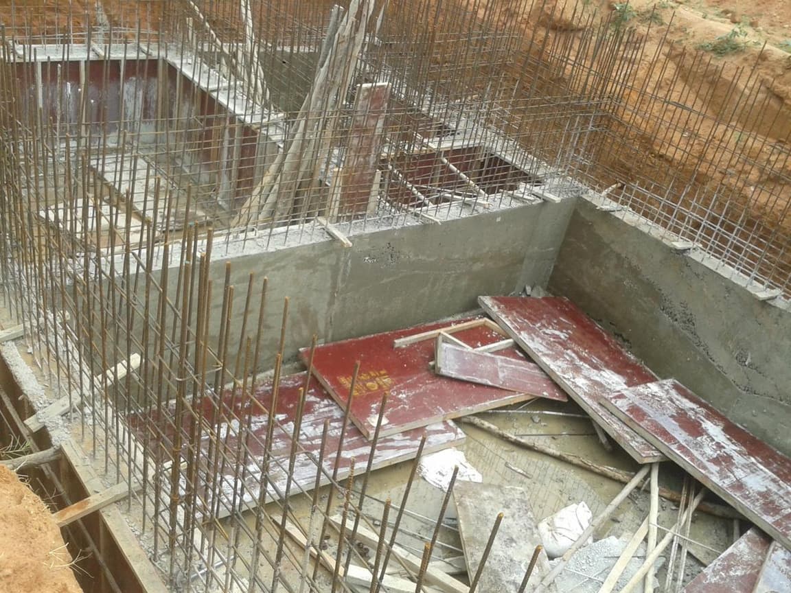 Tank walls cast, with formwork being stripped.