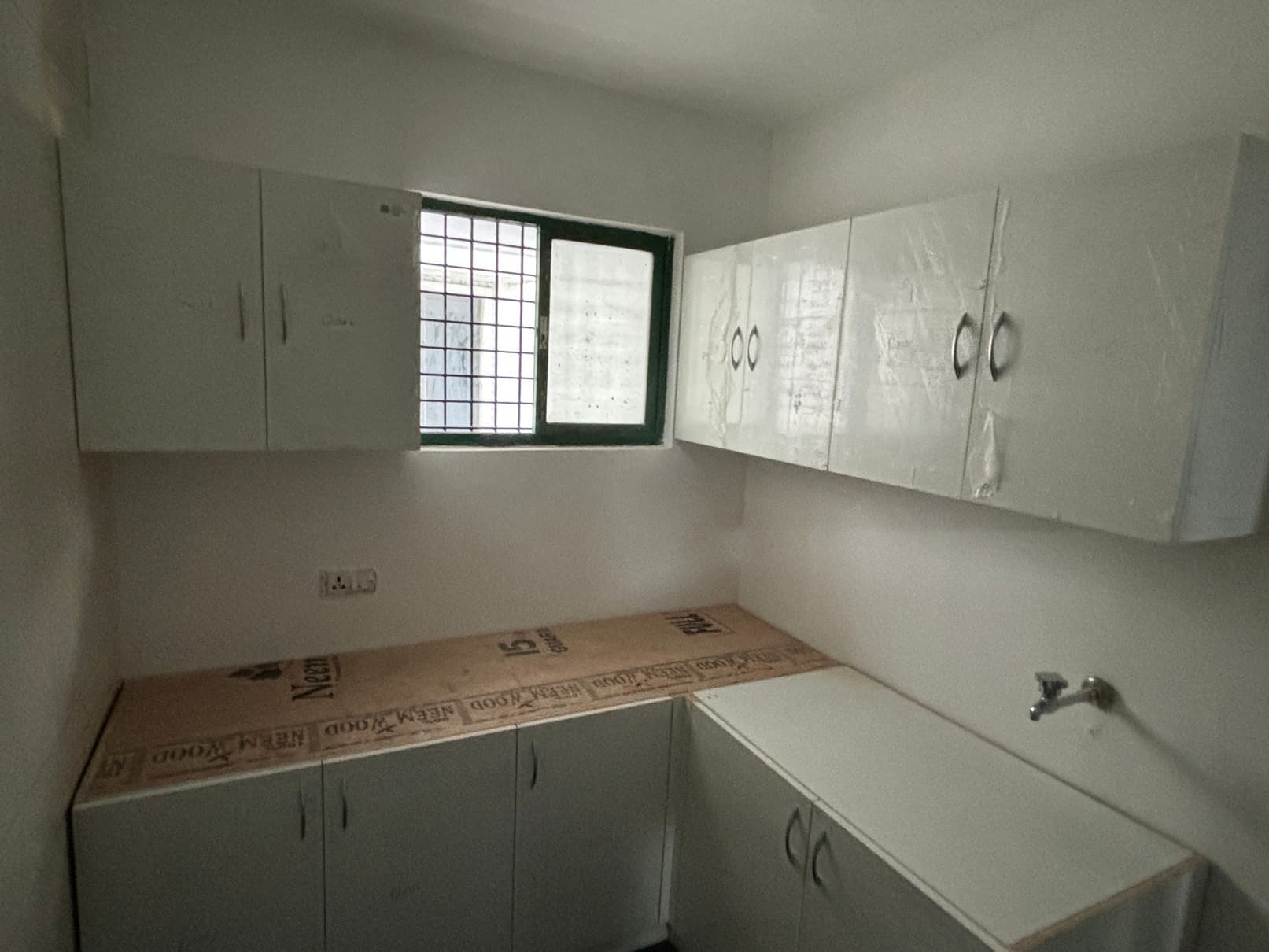 Pantry with wall-mounted and base storage cabinets.